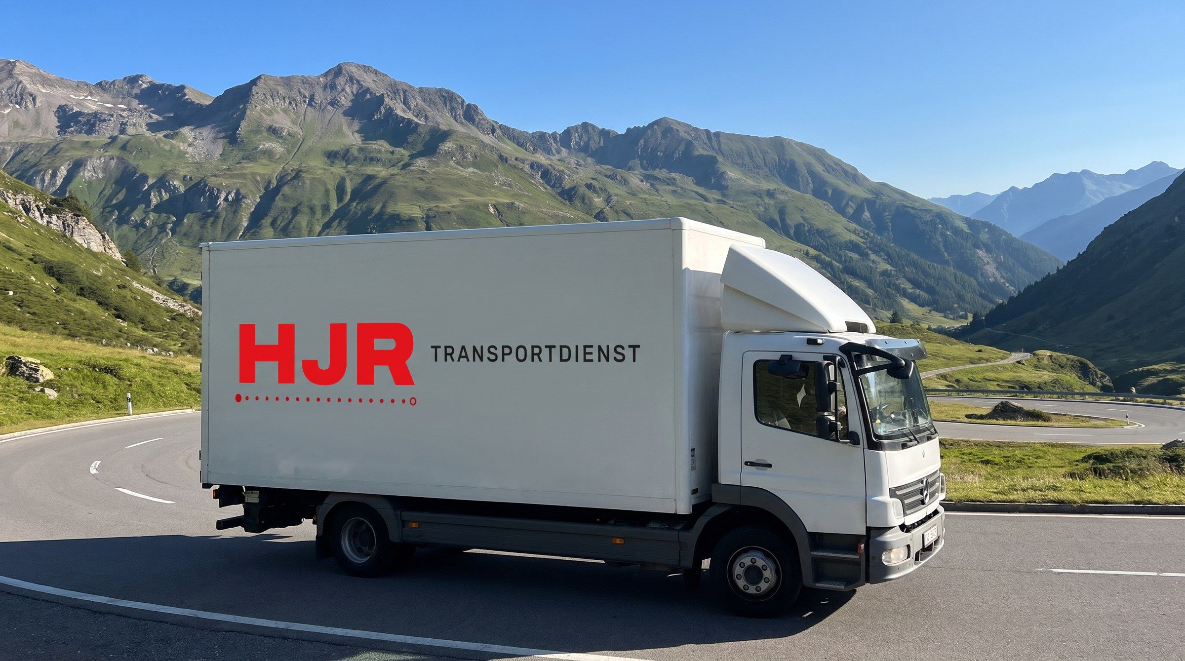 HJR truck on an Alpine pass road